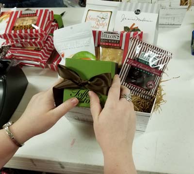 Jesse puts the finishing touches on a basket before shipping.